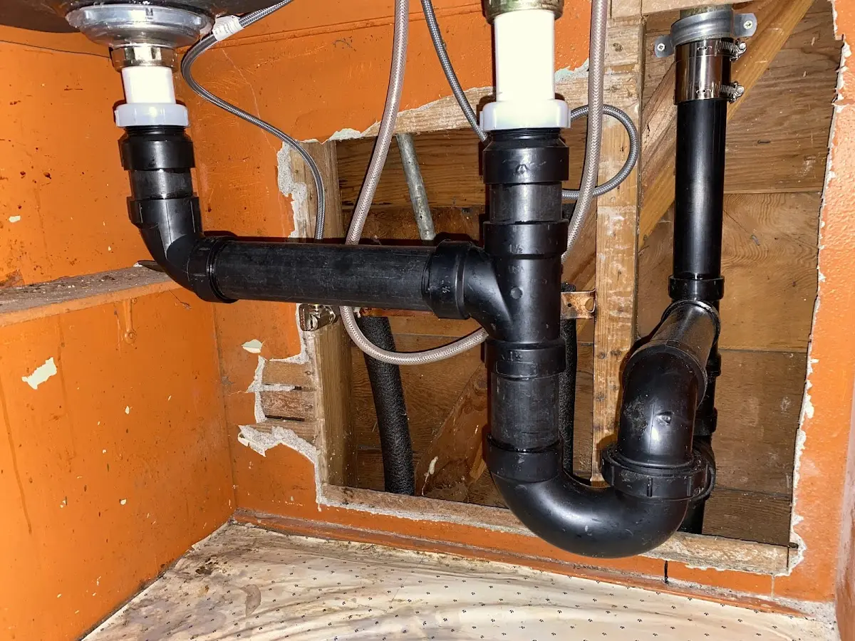 Professional Garbage Disposal Repair equipment and tools on the job in Denver